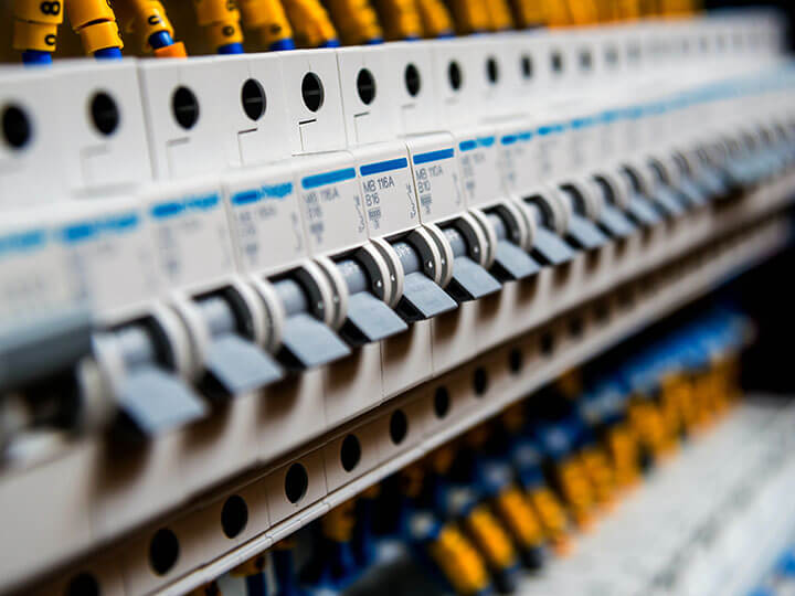 Close up view of voltage switchboard with circuit breakers