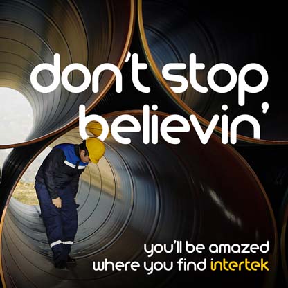 Man performing inspection inside large pipe