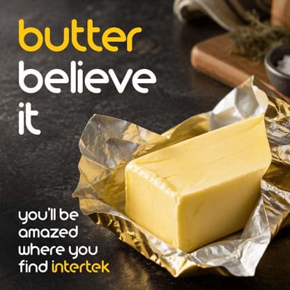 A stick of unwrapped butter on a table